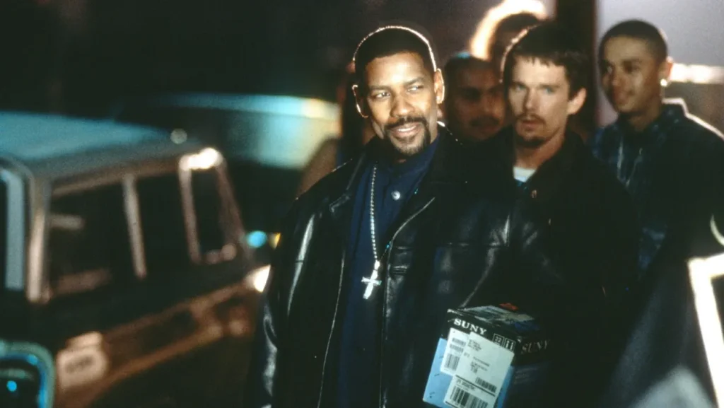 Where to watch Training Day scene still showing a tense street-level moment with the main characters in the film