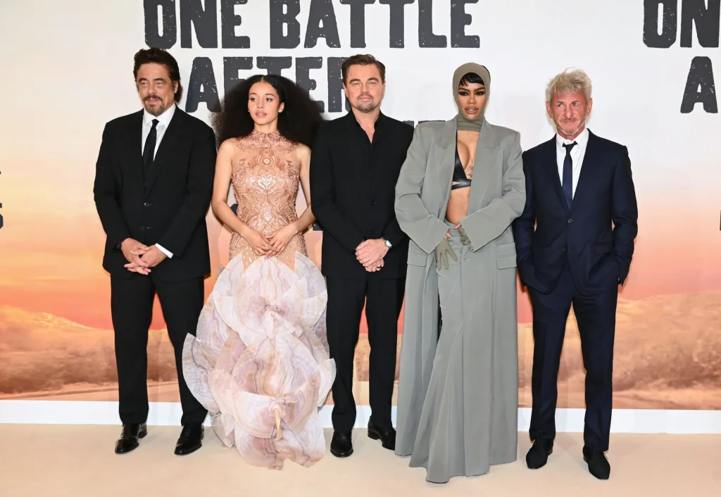 Where to Watch One Battle After Another cast photo featuring the main actors in a promotional group shot for the movie